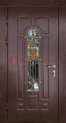 Темная железная дверь со стеклом и ковкой для частного дома ДСК-156 в Жуковском