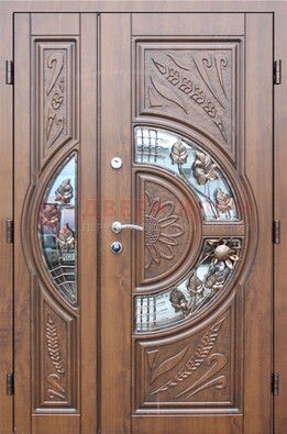 Уличная дверь в цвете Итальянский орех с виноритом и ковкой со стеклом ДВТ-147 в Жуковском